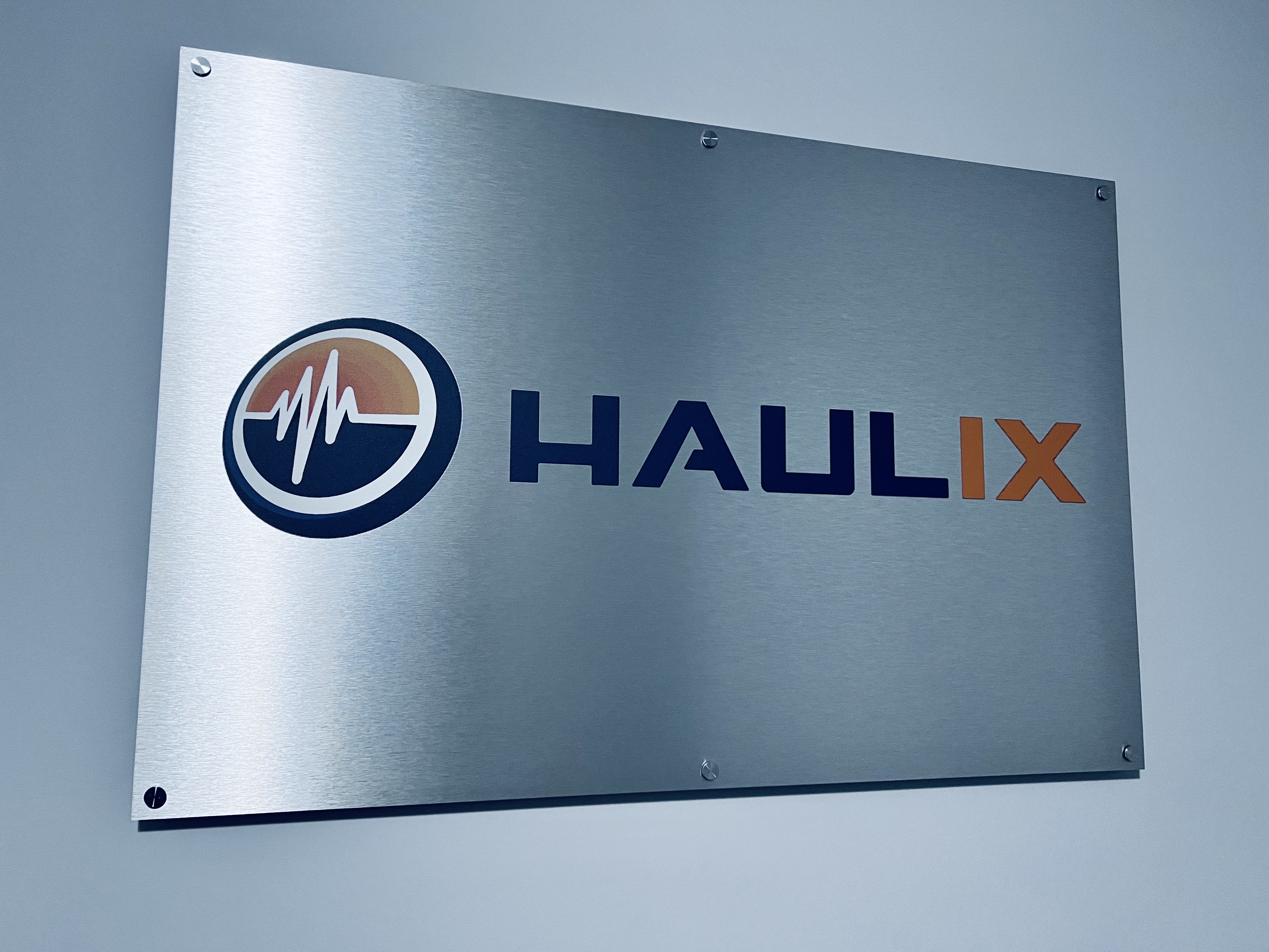 Metal sign with HAULIX logo